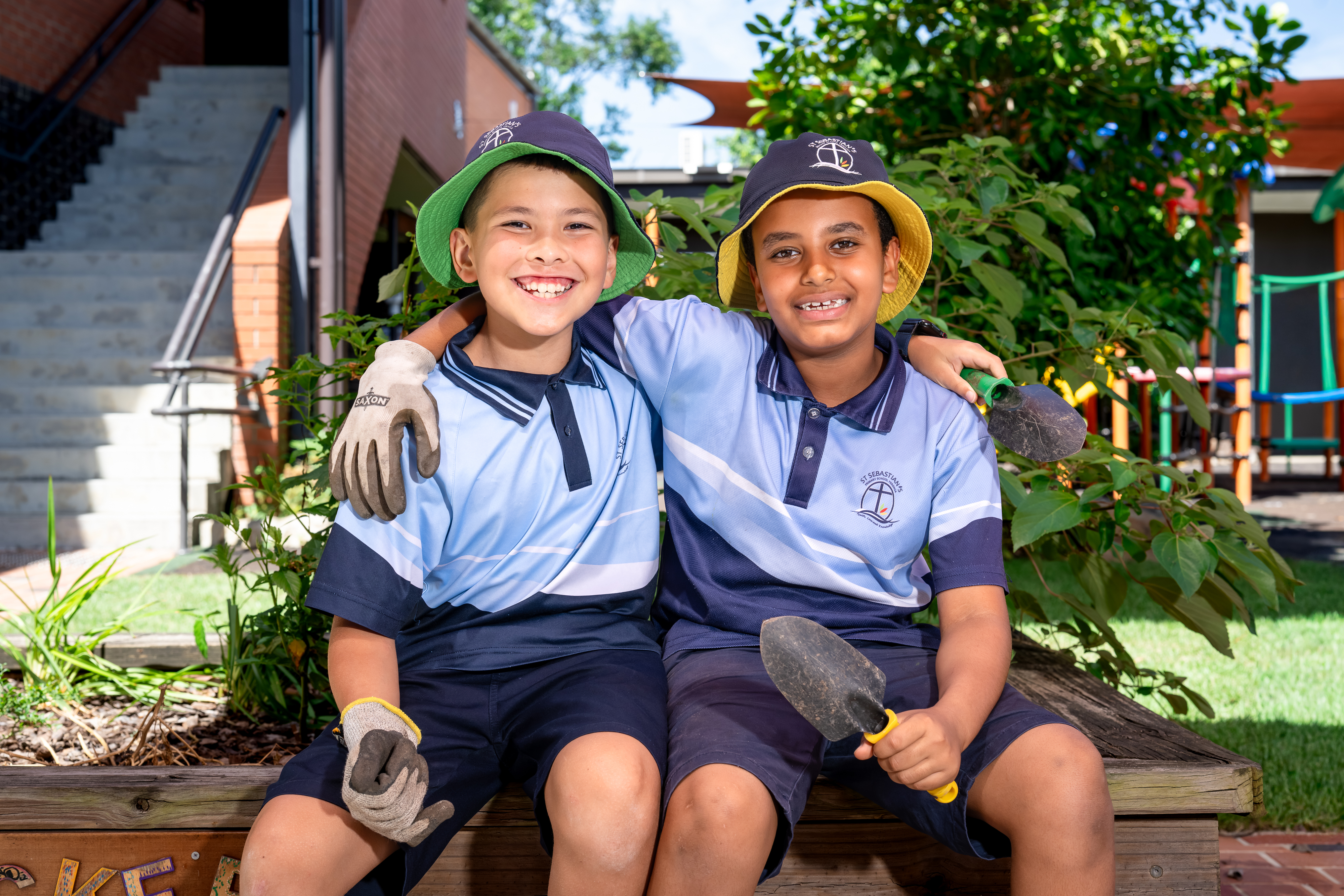 Two male students working in the garden