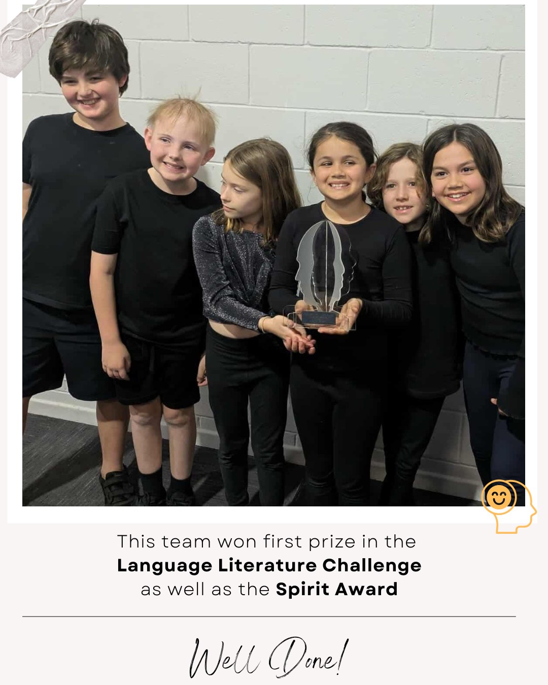Student team holding a trophy after winning school awards.